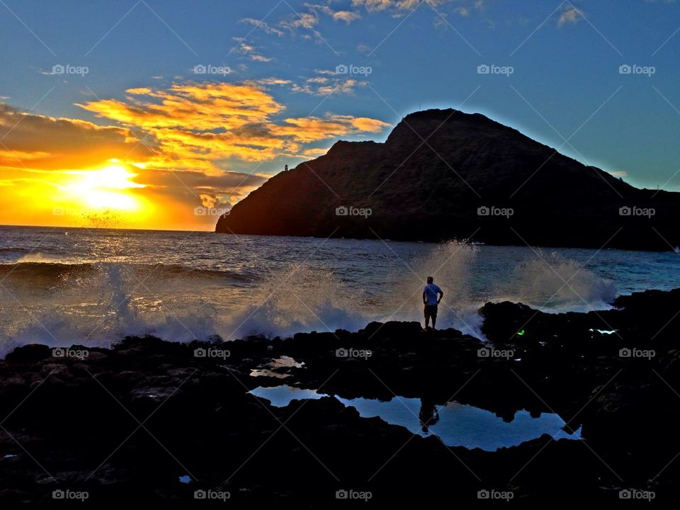 Man in solitude, enjoying sunrise