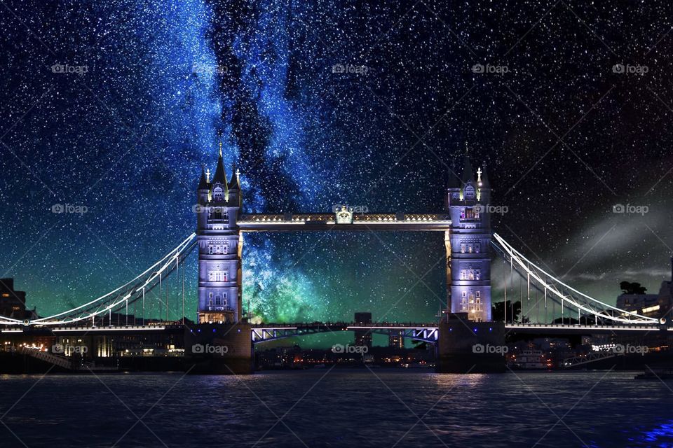 London Bridge at night with the milky way in the sky.