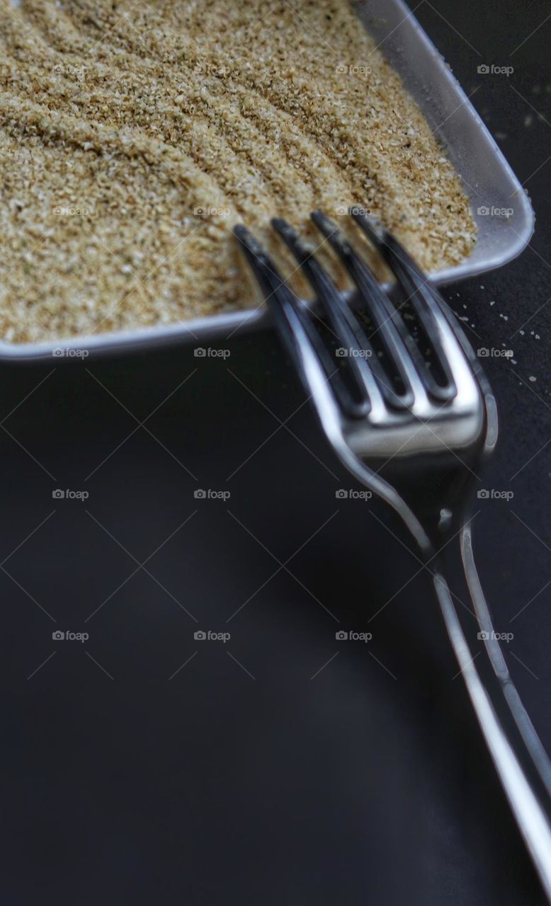 Fork used as a rake in a Zen Garden.