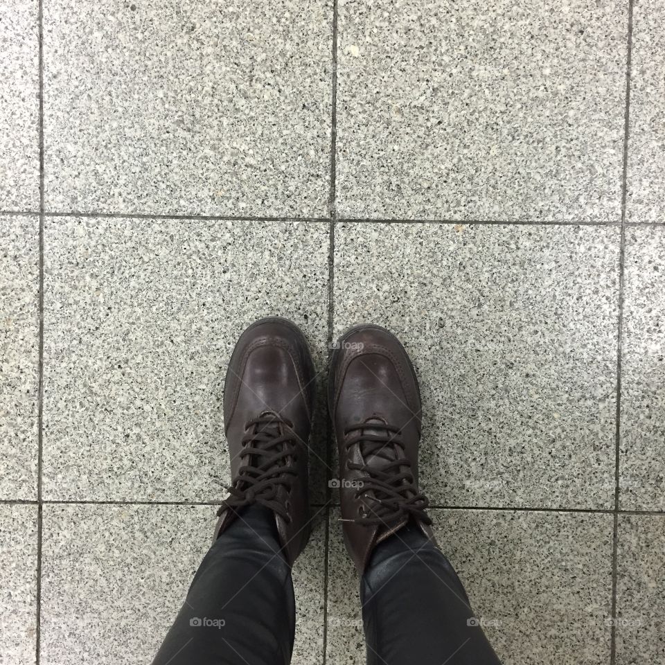 Legs and shoes. Conceptual image of legs in boots. Feet shoes walking in nature