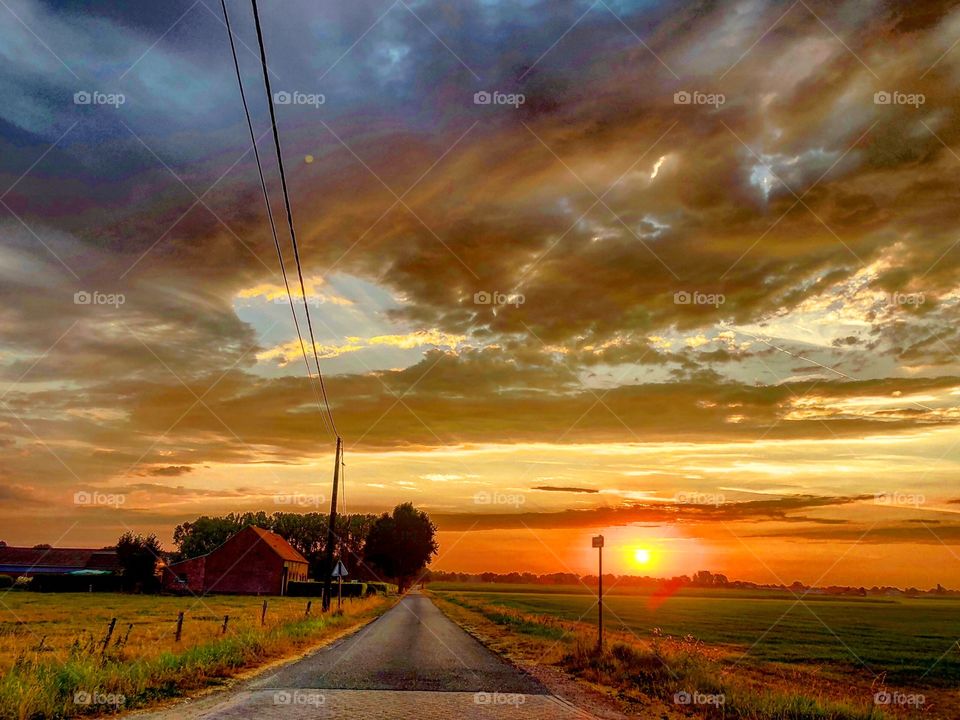Countryside Road to a dramatic sunrise 