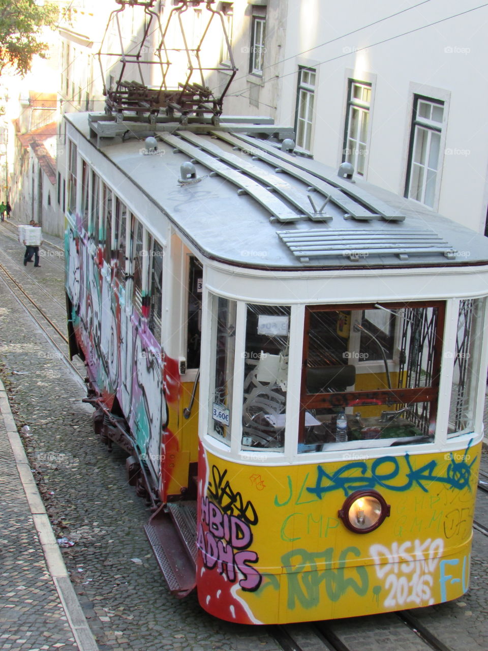 Graffiti tram on a street