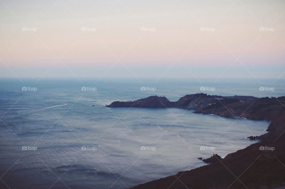 San Francisco cove and distant lighthouse.