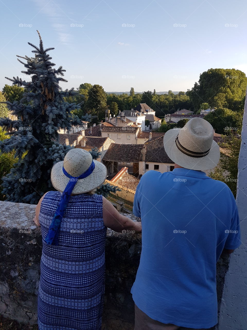 Couple looking out over historic french town