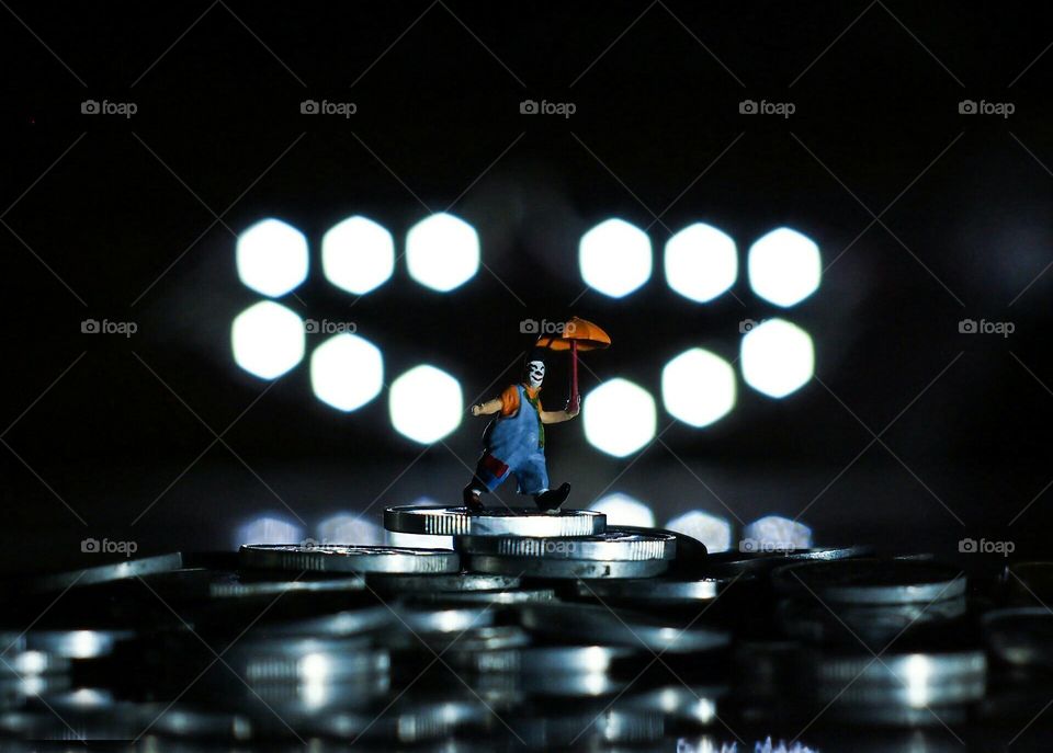 The miniature of clown dancing in the dark
