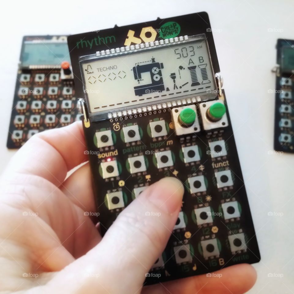 A woman's hand holding a rythem Pocket Operator Synthesizer favorite gadget