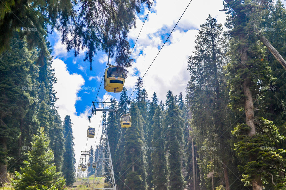 Rope ways or Gandola Cable car in Gulmarg Ski Area of Jammu and Kashmir called 'Paradise on Earth' in India. World's highest operating cable cars and a popular tourist attraction. Stunning photograph.