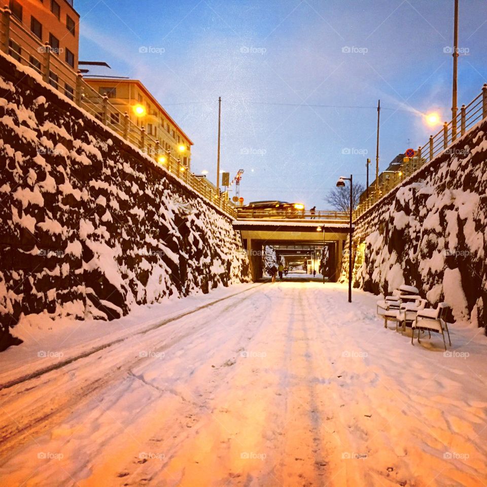 Dusk in a snowy walkway in downtown Helsinki 
