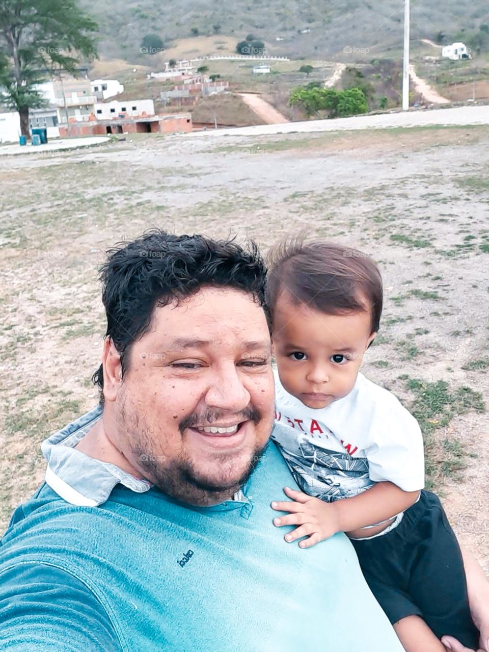 father and son showing off their natural beauty of being a man