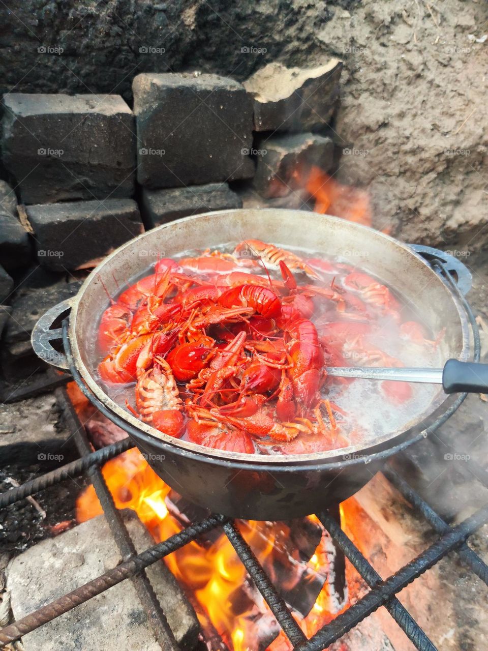 Boiled crayfish in a cauldron
