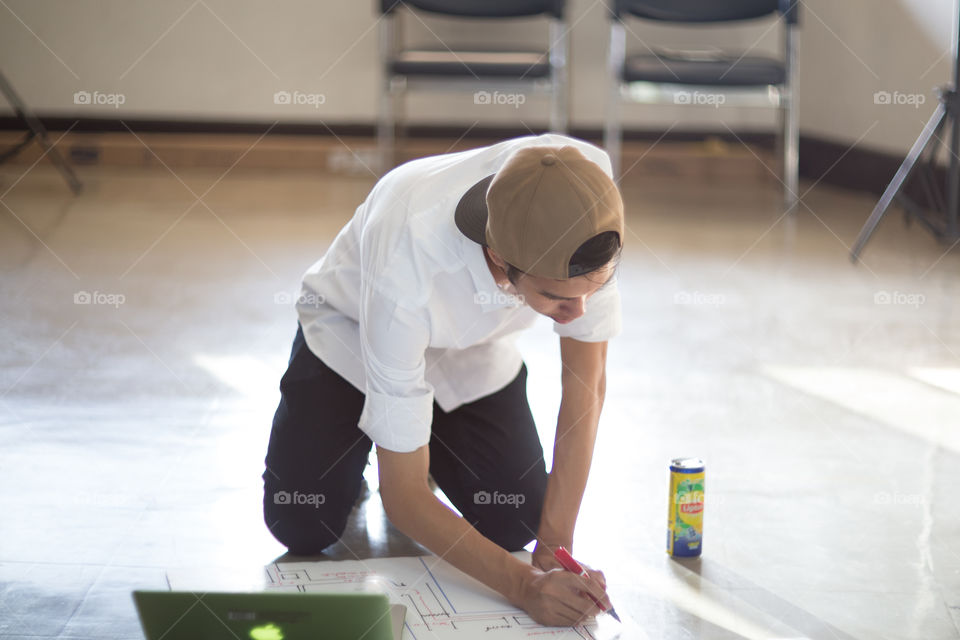 Man writing in a paper