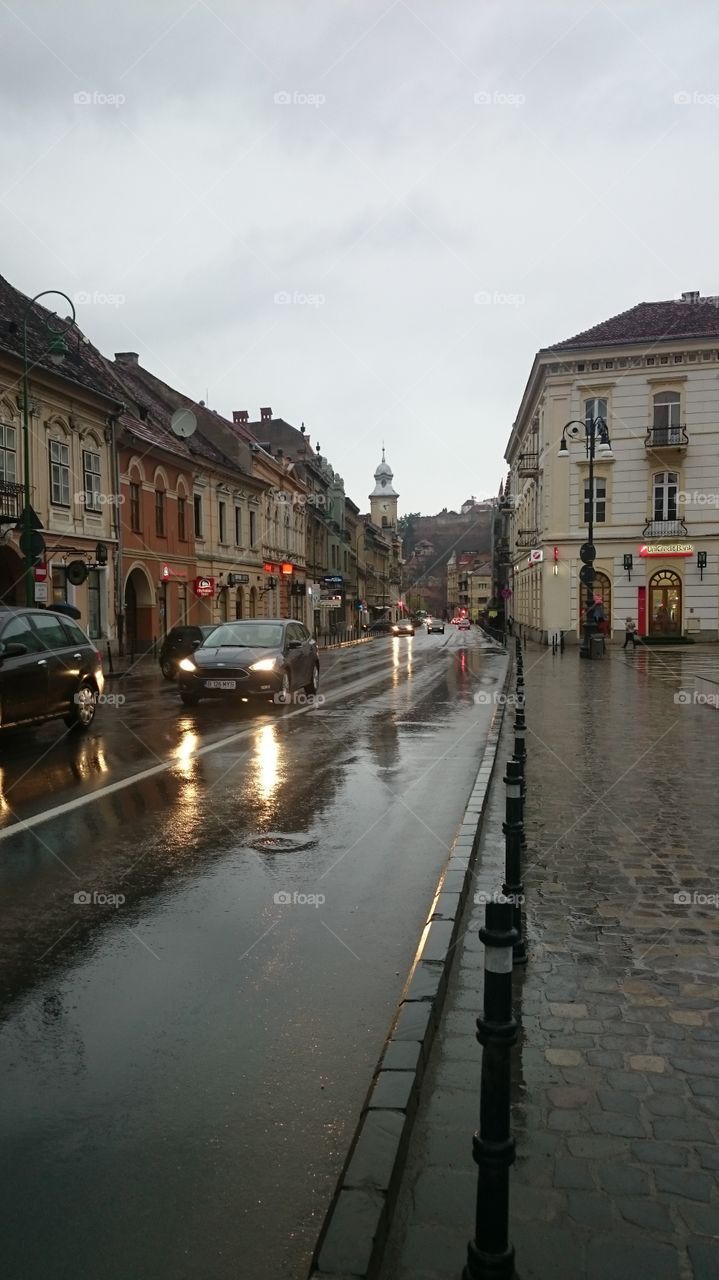 walking in the city though rain