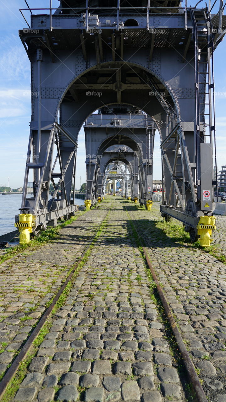 Display of old cranes on rails in Antwerp, Belgium.