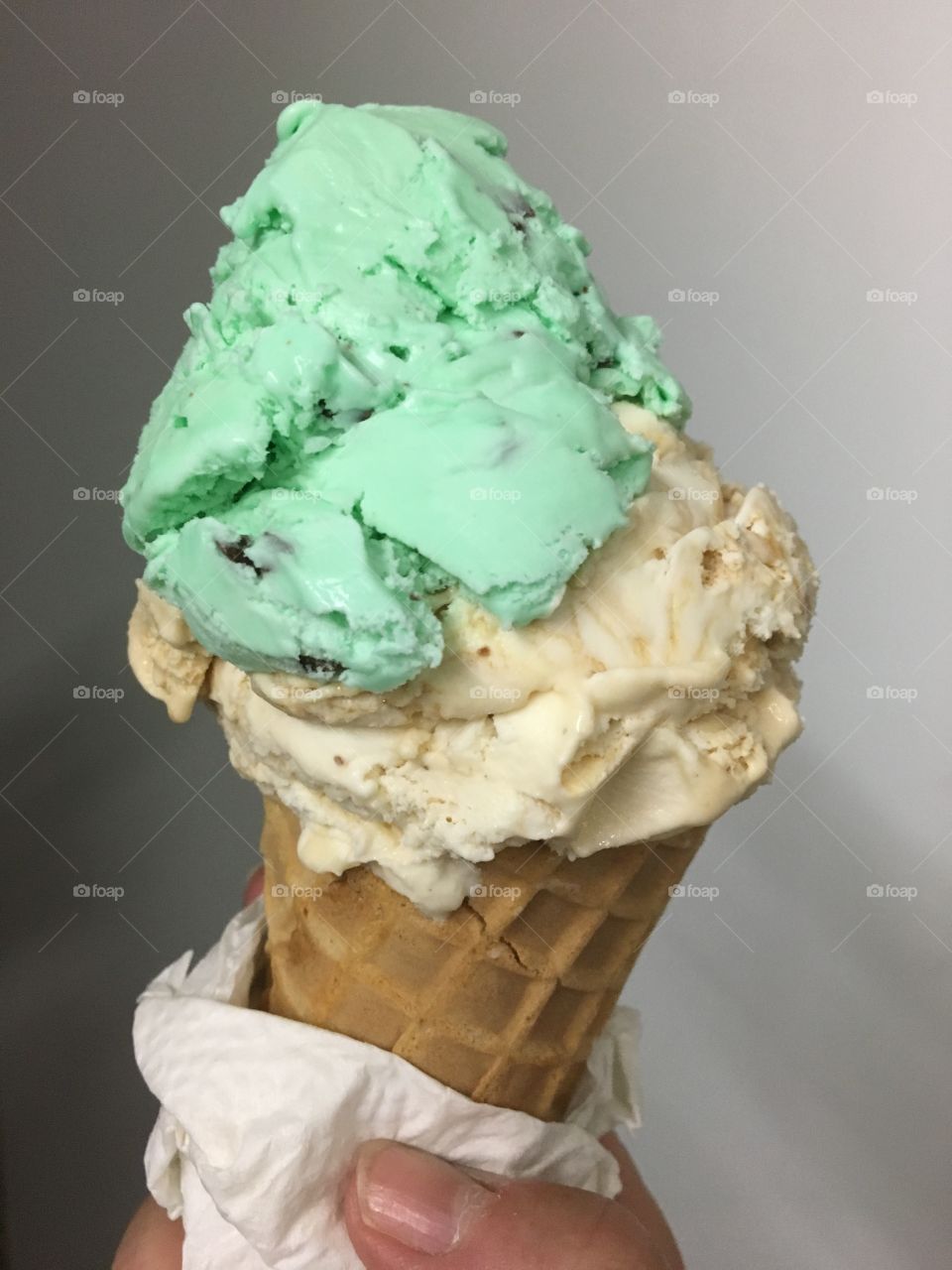 Mint chip & pralines ice cream in waffle cone 