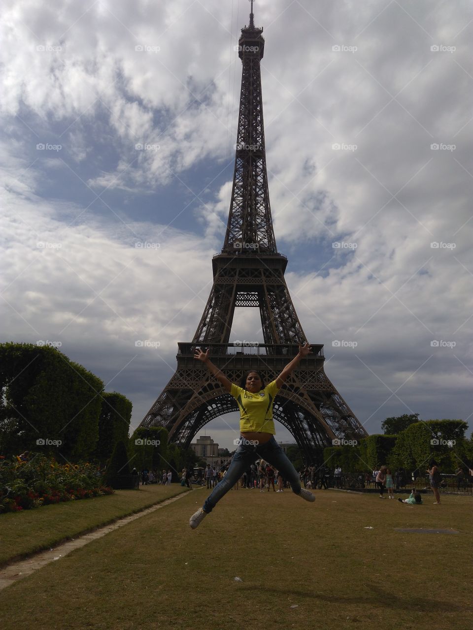 Woman jumping in front of eiffel tower