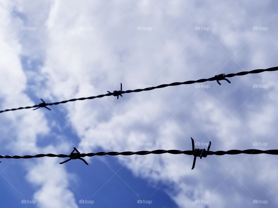 Barb wire in the clouds