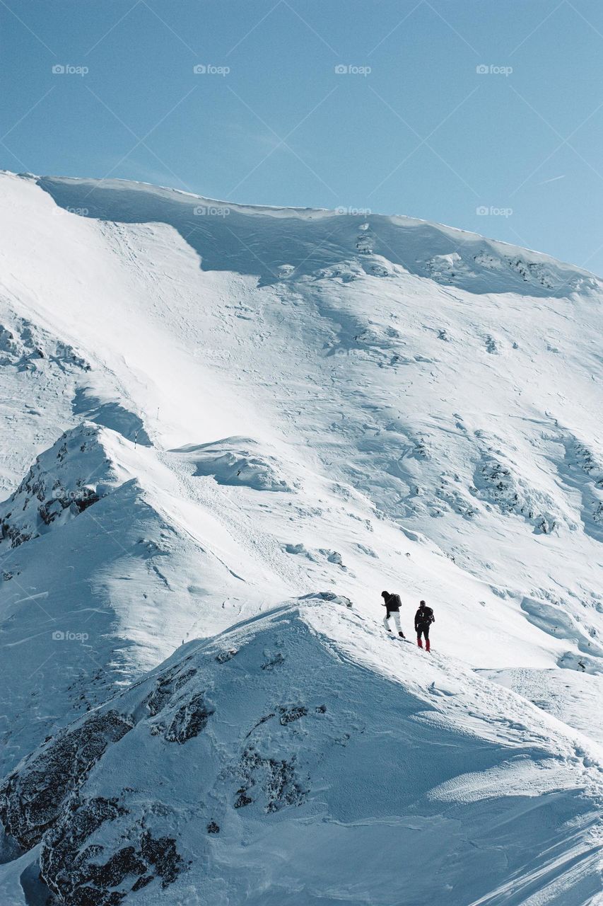 snowy hike towards the peak of the mountain