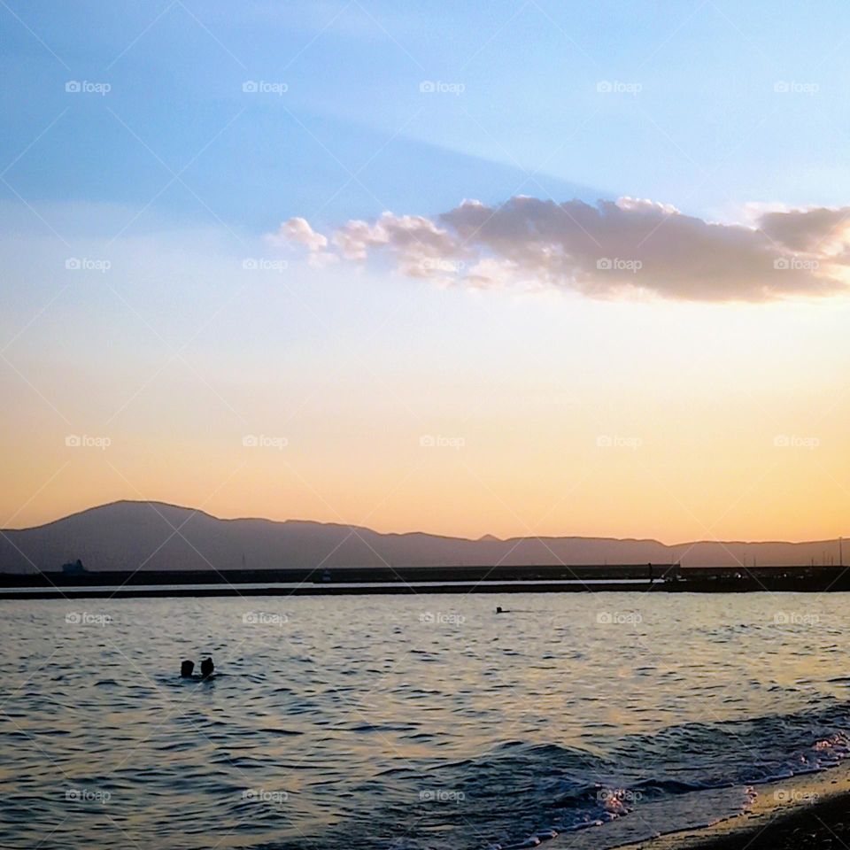 Summer bath while  the sun going down