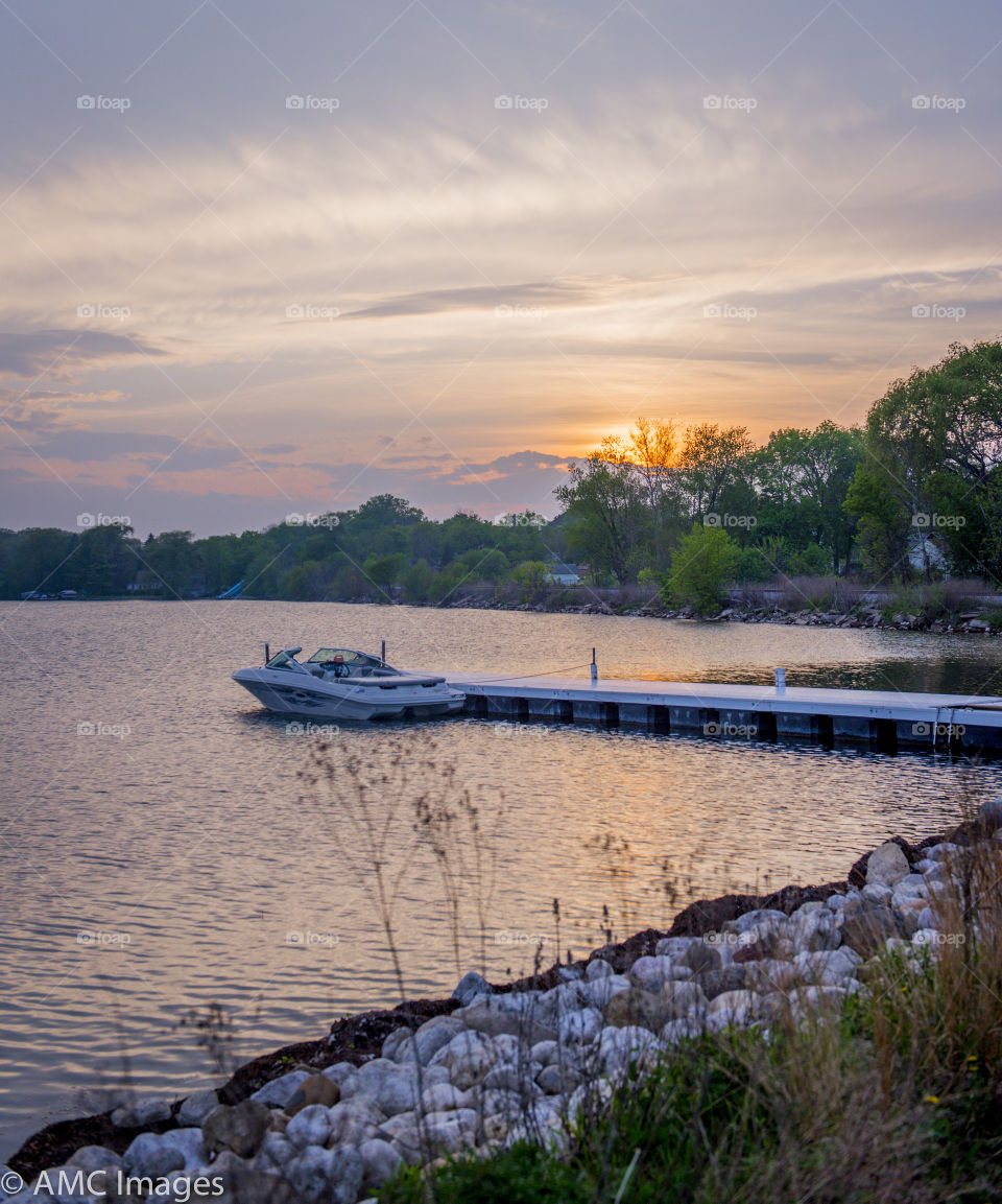 Sunset on Pewaukee Lake in Wisconsin. Sunset on the shoreline of Pewaukee Lake in Wisconsin