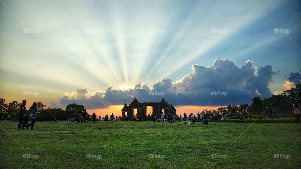 sunset view with spreading sun shine at ratu boko archaelogical site, near Jogjakarta, Indonesia