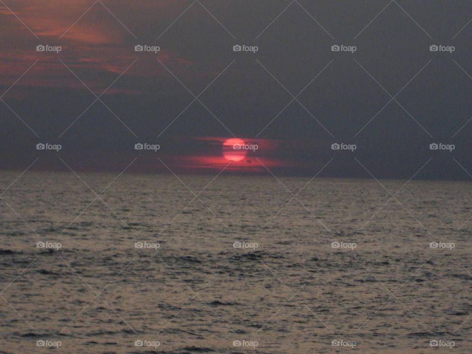 Deep red sunset over ocean