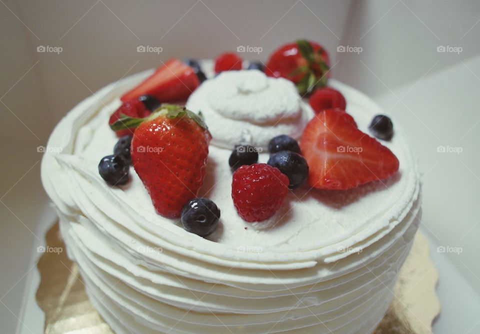 Cake garnished with berry fruits