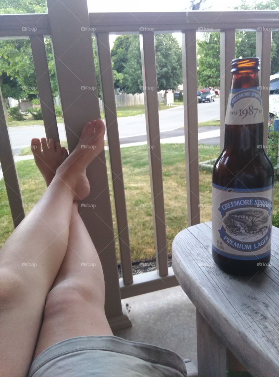relaxing with a beer on the porch