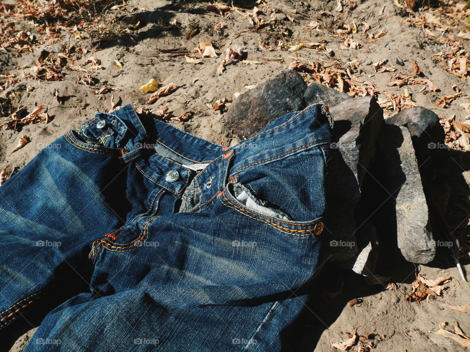 jeans lie on sand