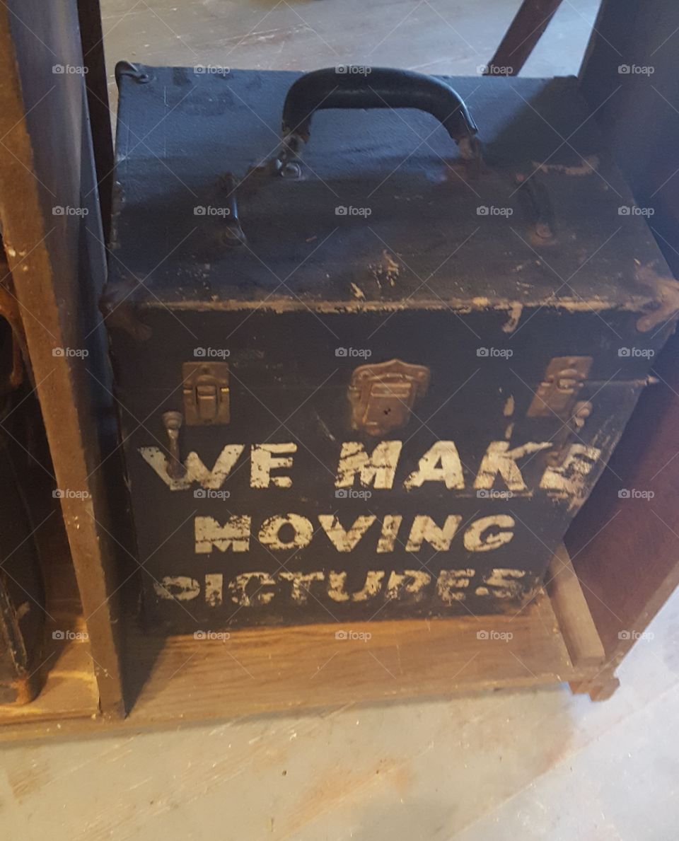 This picture was taken at the Niles Film Museum . An old box possibly used to hold film reels or parts for movie cameras