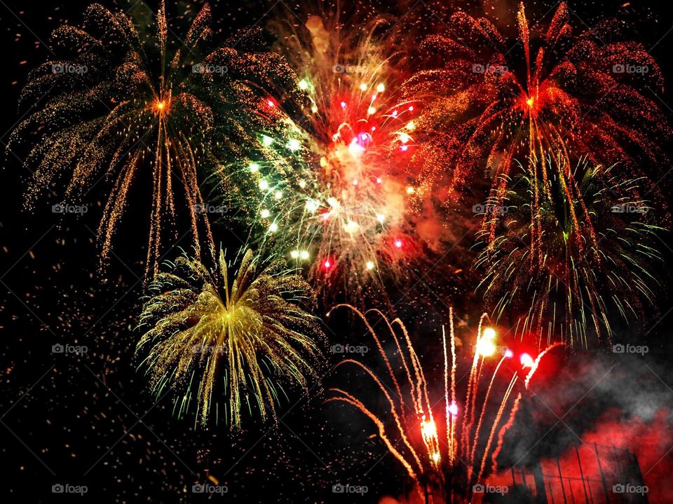 Fireworks exploding in vivid colors.