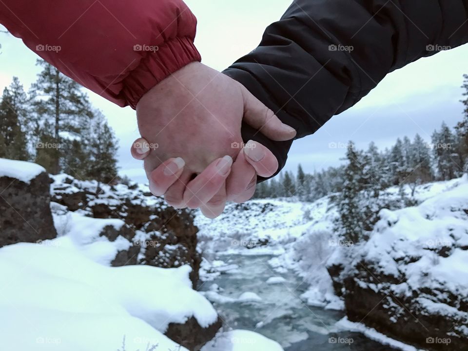 Love by the river in winter