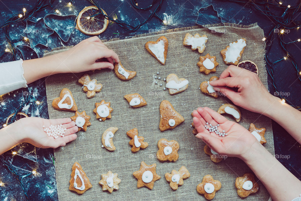 High angle view of two people preparing cookies