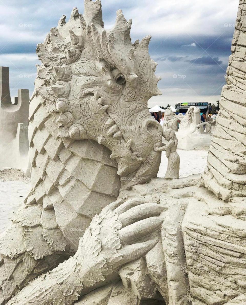 Sand sculpture dragon with princess