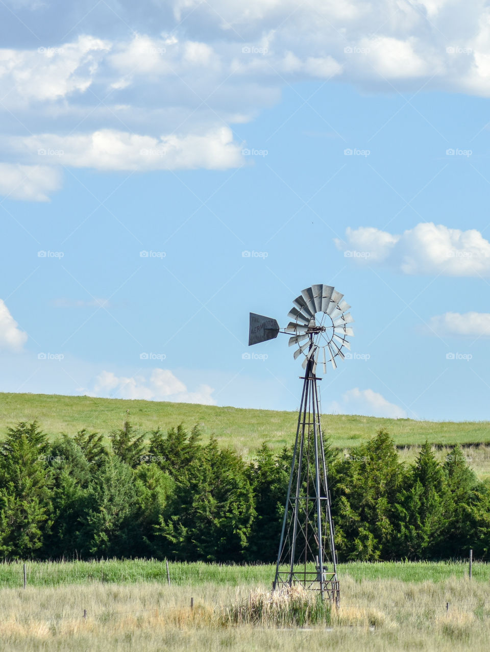 windmill in a field in nebraska