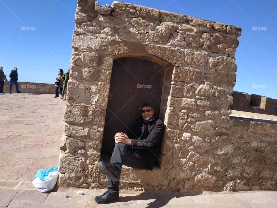 Im sitting on an ancient wall  at essaouira city in Morocco.