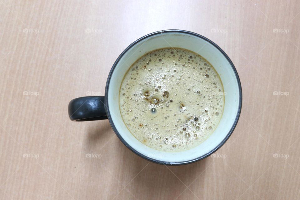 A cup of latte in the morning in an office
