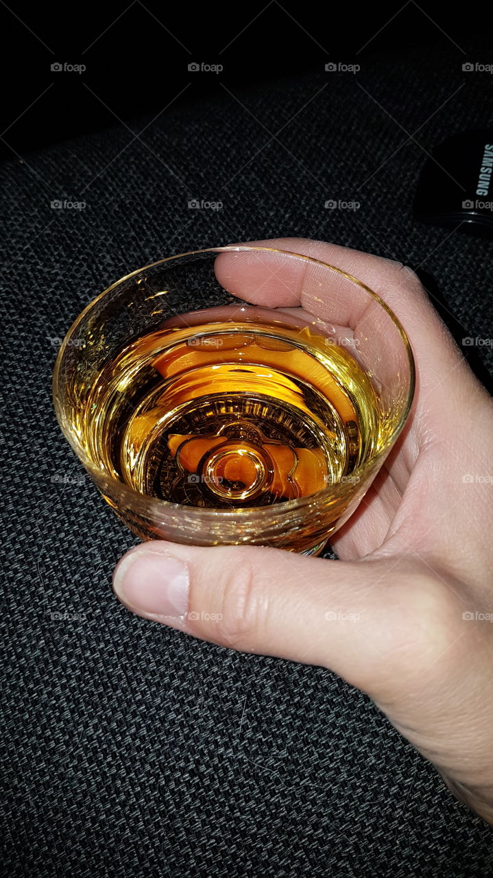 A glass of whisky.