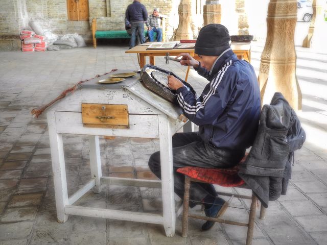 Took this picture when I was walking in old town of Bukhara. It was fun to watch that guys working. 