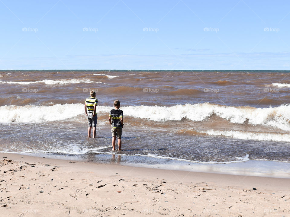 Boys playing in the surf