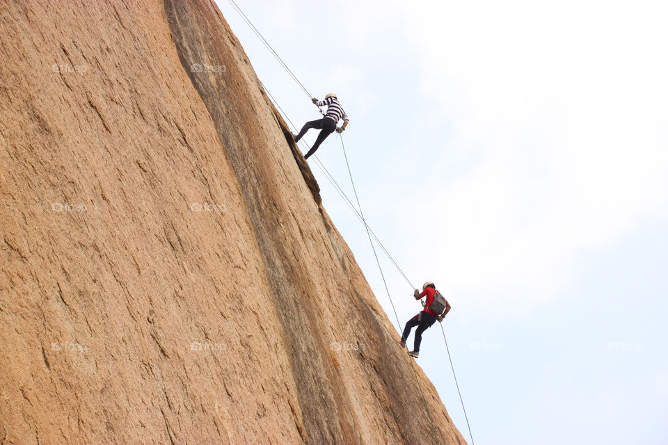 Rappelling in summer, rocks adventure