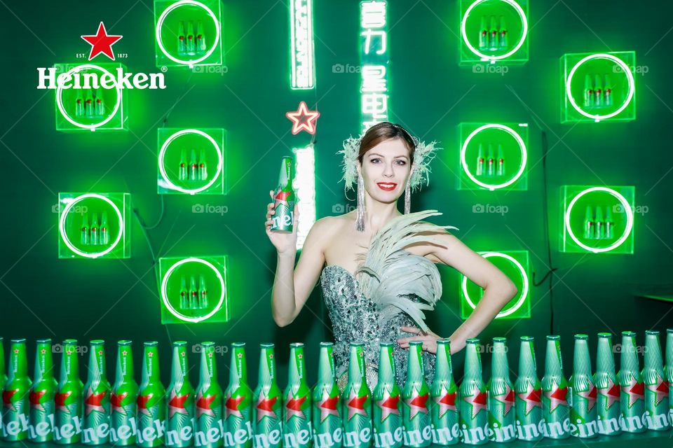 Beautiful model holding beer 