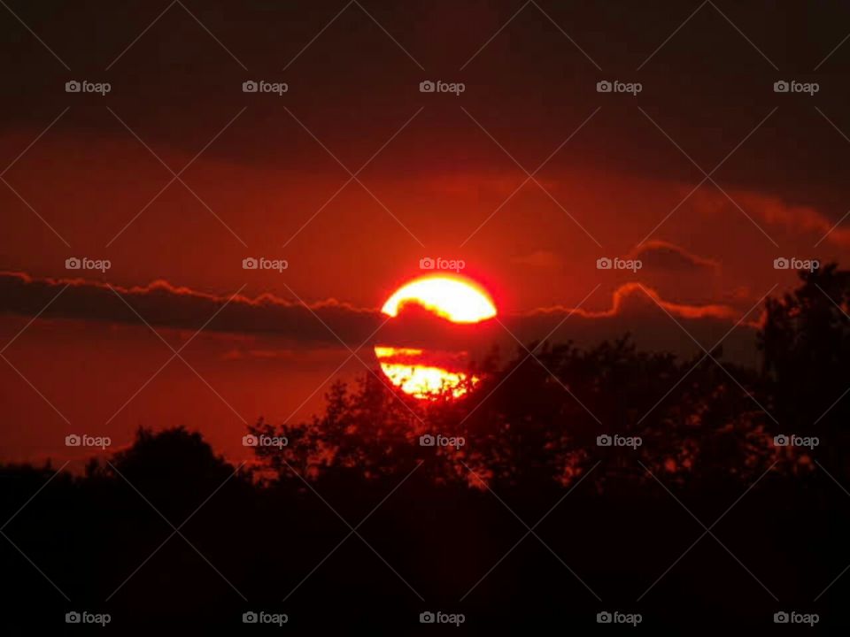 fiery red sky brings glowing warmth.