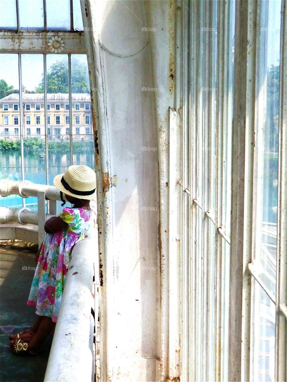 Little girl in romantic clothes at Kew Gardens