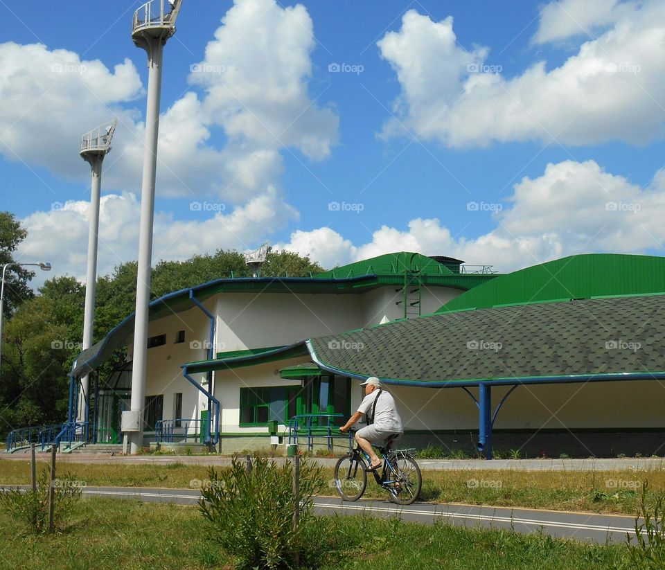 summer city view and person riding bike