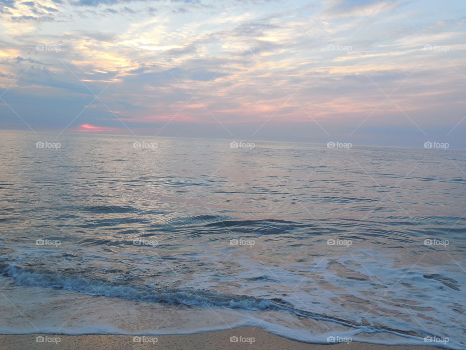 Dewey beach Delaware sunrise left side low waves clouds
