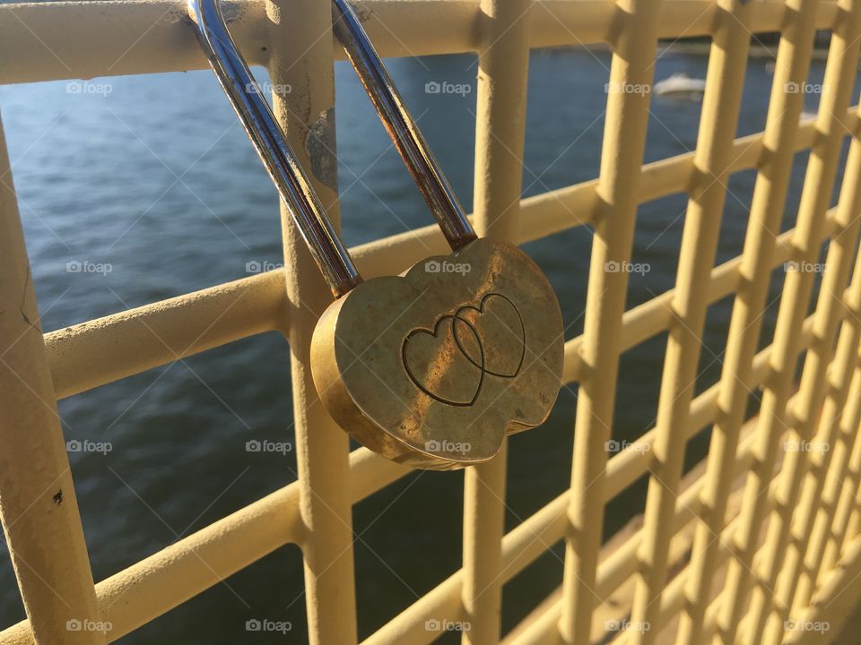 Locks of Love in Pittsburgh, PA. A couple puts a lock on a bridge to promise they will stay together. 
