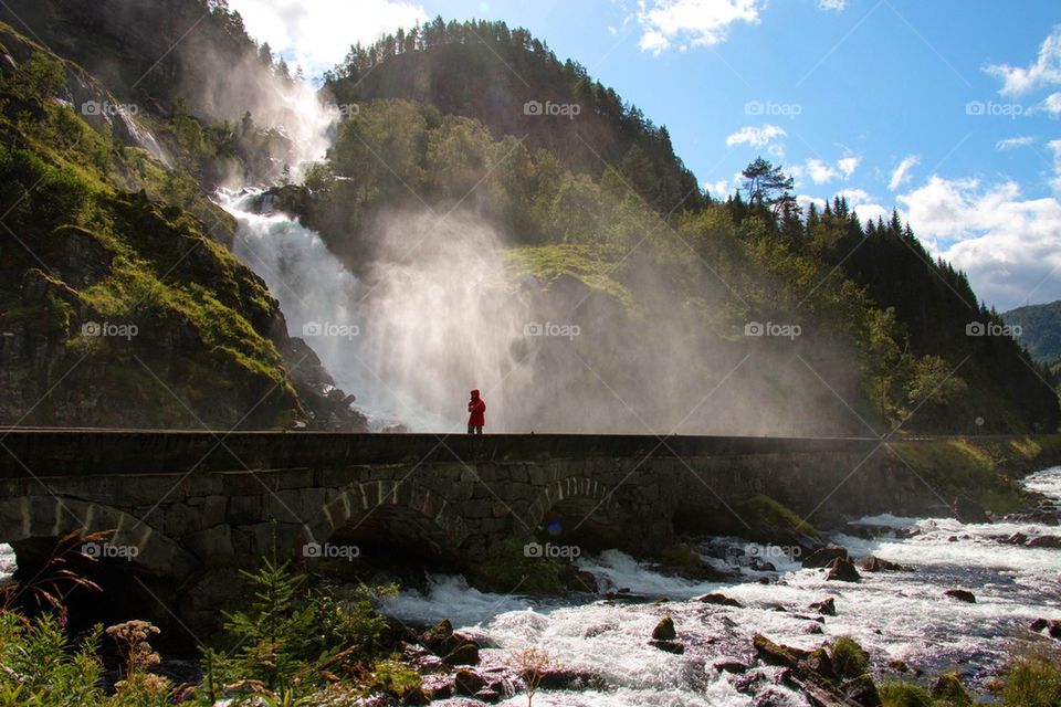 Låtefossen waterfall and woman 