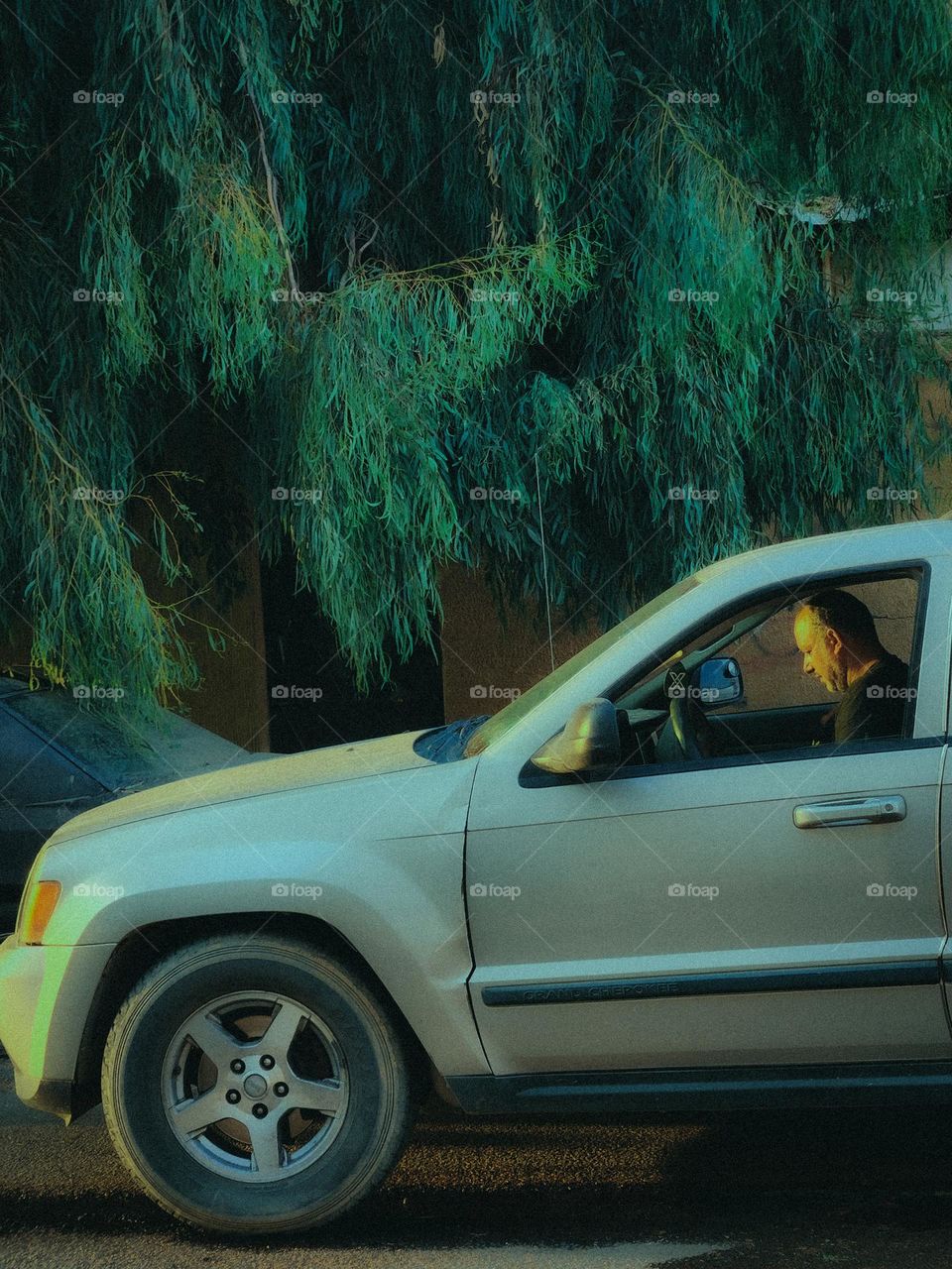 A jeep parked on a roadside.