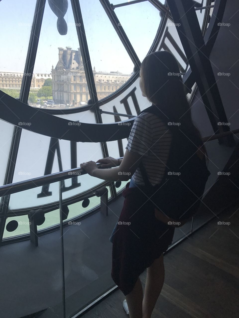 Woman standing in clock tower