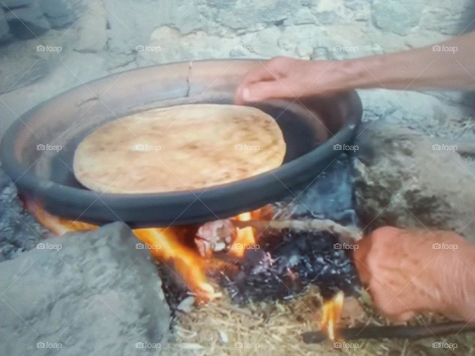  Preparation of  Moroccan bread over the oven.
